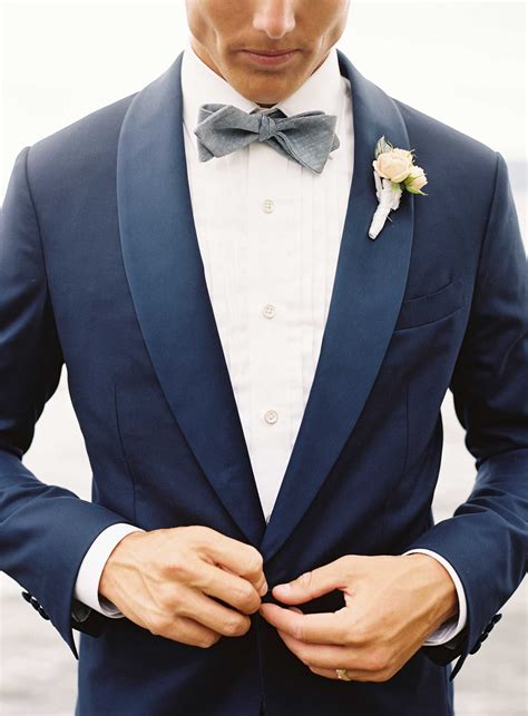 gray suit blue bow tie.